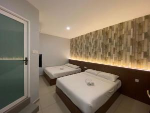 Postel nebo postele na pokoji v ubytování DS Hotel