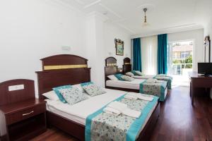 Postel nebo postele na pokoji v ubytování Sunberk Hotel