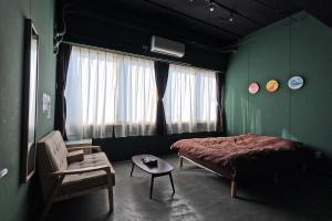 Postel nebo postele na pokoji v ubytování Tasogare Hostel