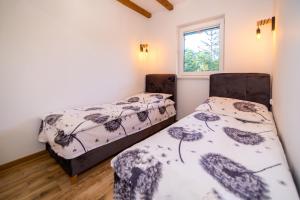 Postel nebo postele na pokoji v ubytování Apartament Marta