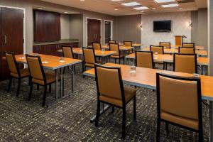 a conference room with tables and chairs and a tv at SpringHill Suites by Marriott Pittsburgh North Shore in Pittsburgh +33 photos