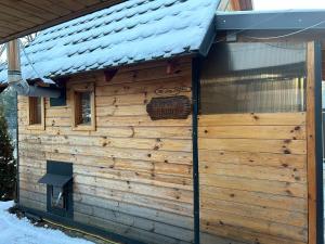 a log cabin with a sign on the side of it at Willa Emma in Poronin
