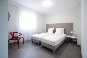 Postel nebo postele na pokoji v ubytování Residence Saletta Casale