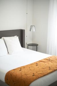 Postel nebo postele na pokoji v ubytování Residence Saletta Casale