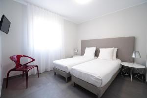 Postel nebo postele na pokoji v ubytování Residence Saletta Casale