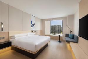 Postel nebo postele na pokoji v ubytování Fairfield by Marriott Yiwu
