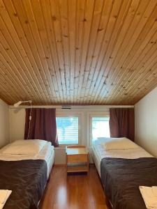 En eller flere senge i et værelse på Kulta-Katti Apartments