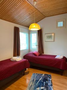 En eller flere senge i et værelse på Kulta-Katti Apartments