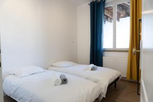 Ένα ή περισσότερα κρεβάτια σε δωμάτιο στο Le 73 Chambéry
