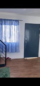a room with a door with a window and a door at Lubrin Townhouse in San Pablo