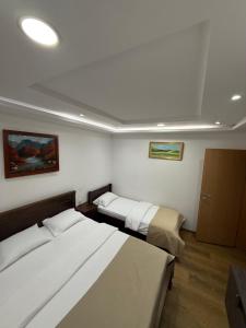 Postelja oz. postelje v sobi nastanitve Hotel Pavlović