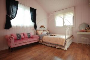 Ein Bett oder Betten in einem Zimmer der Unterkunft Pyeongchang Edelweiss Pension