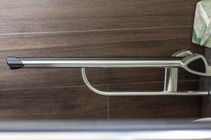 a metal door handle on a wooden door at Costa Rica Bibione SPA in Bibione