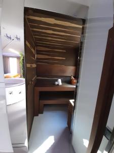 a small kitchen with a sink and a desk at Costa Rica Bibione SPA in Bibione