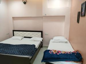 Letto o letti in una camera di Shri Mahaveer Residency
