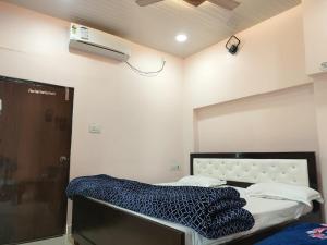 Letto o letti in una camera di Shri Mahaveer Residency