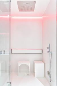 a bathroom with a shower and a sink at Costa Rica Bibione SPA in Bibione