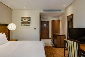 Postel nebo postele na pokoji v ubytování Protea Hotel by Marriott Benin City Select Emotan