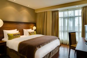 Postel nebo postele na pokoji v ubytování Protea Hotel by Marriott Benin City Select Emotan
