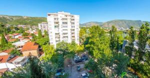 an overhead view of a city with a tall building at Francis First in Mostar