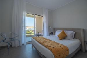 Postel nebo postele na pokoji v ubytování Residence Saletta Casale