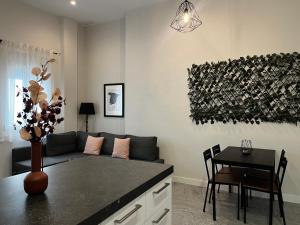 a living room with a couch and a table at Kadis-Korazon Grupo AC Gestion in Cádiz +15 photos