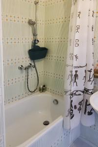 a bathroom with a bath tub and a sink at Take a rest in the center of Krakow, Zyblikiewicza in Kraków