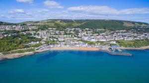 an aerial view of a beach with a city at Kildare in Niton
