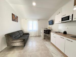 Kuchyň nebo kuchyňský kout v ubytování Apartments Tereza