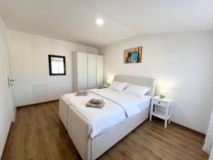 Postel nebo postele na pokoji v ubytování Apartments Tereza