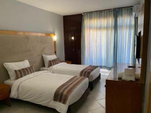 Letto o letti in una camera di Hotel Oscar 1