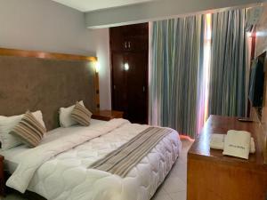 Letto o letti in una camera di Hotel Oscar 1