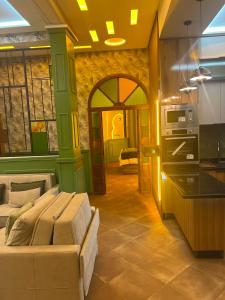 a living room with a couch and a kitchen at Vintage Green House in Fez +12 photos