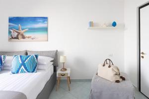 Posteľ alebo postele v izbe v ubytovaní SorrentoVibes - Seaview Home on the beach & amazing views terrace