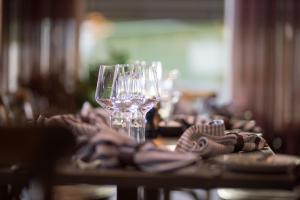 a table with wine glasses and a napkin at Wärdshuset Bredaryd in Bredaryd +24 photos