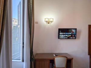 TV a/nebo společenská místnost v ubytování Hotel Philia + 27 fotografií