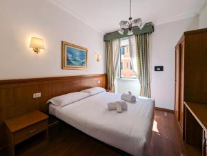 Postel nebo postele na pokoji v ubytování Hotel Philia