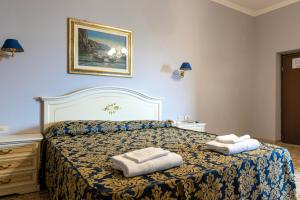 Postel nebo postele na pokoji v ubytování Hotel Philia