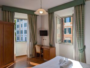 Postel nebo postele na pokoji v ubytování Hotel Philia