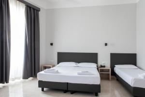 Postel nebo postele na pokoji v ubytování Hotel Philia