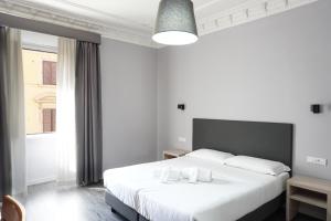 Postel nebo postele na pokoji v ubytování Hotel Philia