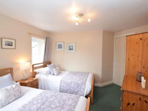 Ένα ή περισσότερα κρεβάτια σε δωμάτιο στο Lake District Family Getaway +2 φωτογραφίες