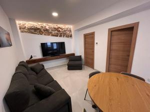 a living room with a couch and a table at Apartamento La Fragua - A ESTRENAR - BRAND NEW in Chulilla