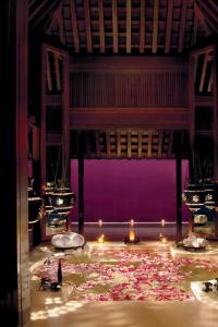 a stage with a bunch of flowers on the floor at Phulay Bay, A Ritz-Carlton Reserve in Tab Kaek Beach