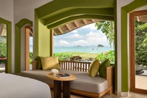 a room with a bed and a view of the ocean at Phulay Bay, A Ritz-Carlton Reserve in Tab Kaek Beach