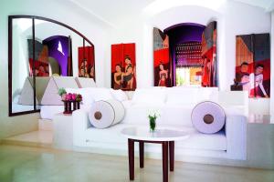 a living room with a white couch and a table at Phulay Bay, A Ritz-Carlton Reserve in Tab Kaek Beach