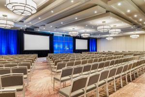 a conference room with chairs and a screen at The Westin Toronto Airport in Toronto +45 photos