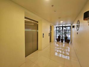 a hallway with a door in a building at 803 - Quiet Condo in City Centre in Davao City