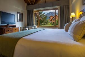 Una cama o camas en una habitación de Los Cauquenes Resort + Spa + Experiences