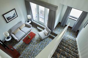 an overhead view of a living room with a couch and chair at Manchester Marriott Victoria & Albert Hotel in Manchester